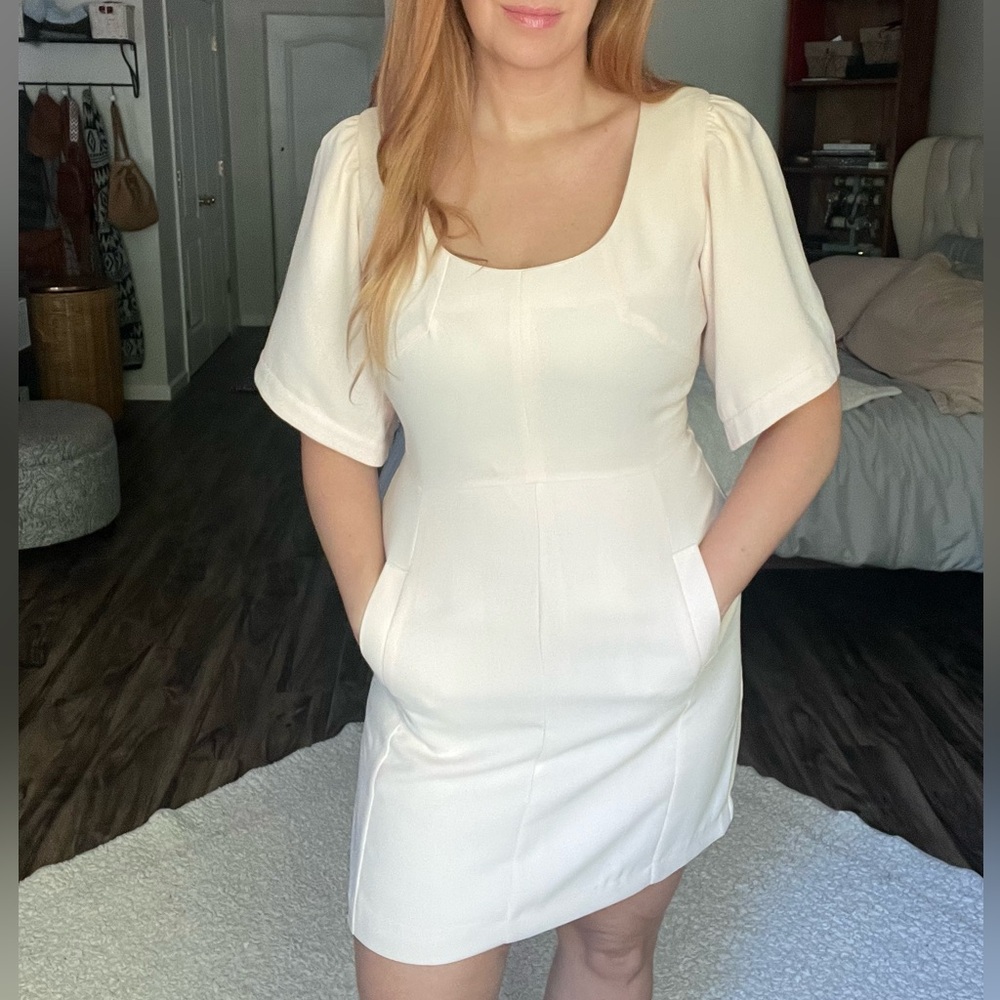Light pink mini dress with button up back
